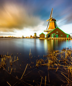 Scenic view of a windmill against sky at sunset