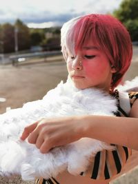 Girl touching feathers