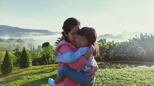 Mother and daughter on field