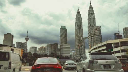 City street against cloudy sky