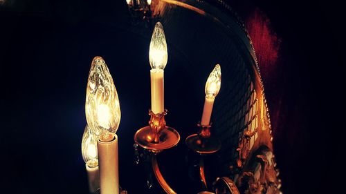 Low angle view of illuminated lights at night