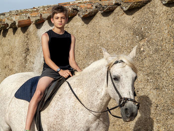 Portrait of woman riding horse