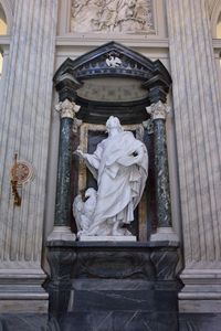 Statue of angel outside building