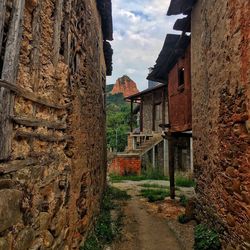 Street amidst buildings against sky