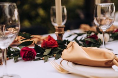 Close-up of wine glasses on table