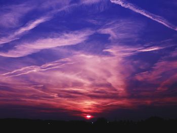 Low angle view of dramatic sky during sunset