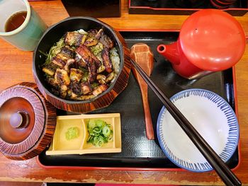 Directly above shot of food in container on tray over table