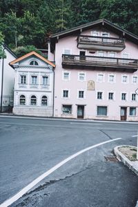 Houses by road in city