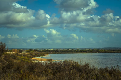 Scenic view of sea against cloudy sky