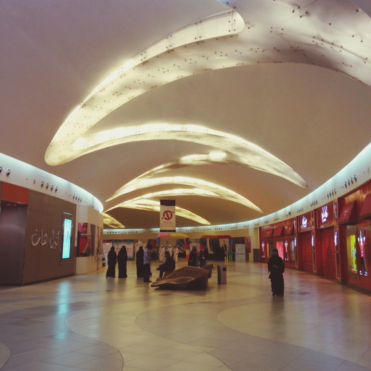 indoors, transportation, railroad station, public transportation, architecture, illuminated, ceiling, built structure, large group of people, travel, arch, person, men, railroad station platform, lifestyles, walking, subway station, rail transportation, incidental people