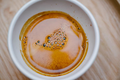 High angle view of coffee in cup on table