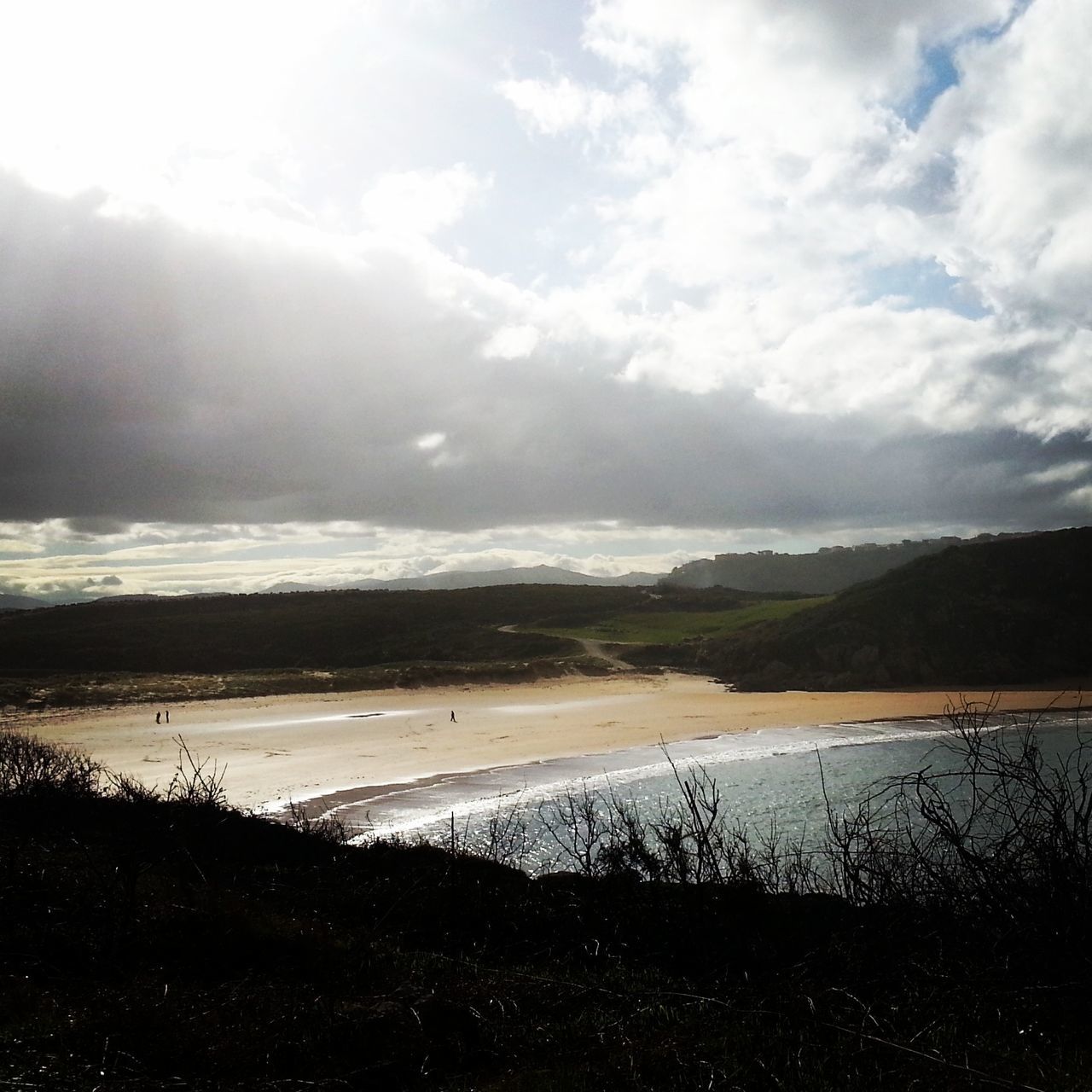 water, beach, tranquil scene, sky, sea, tranquility, scenics, horizon over water, shore, beauty in nature, sand, nature, cloud - sky, cloud, idyllic, coastline, outdoors, calm, remote, cloudy