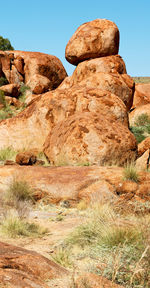 Low angle view of rock formation against clear sky