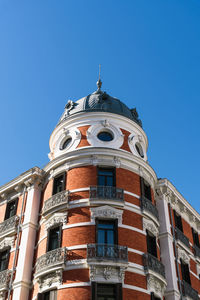 Low angle view of building against blue sky