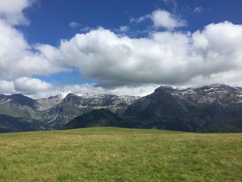 Scenic view of landscape against cloudy sky