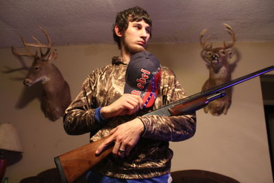 Young man playing against wall