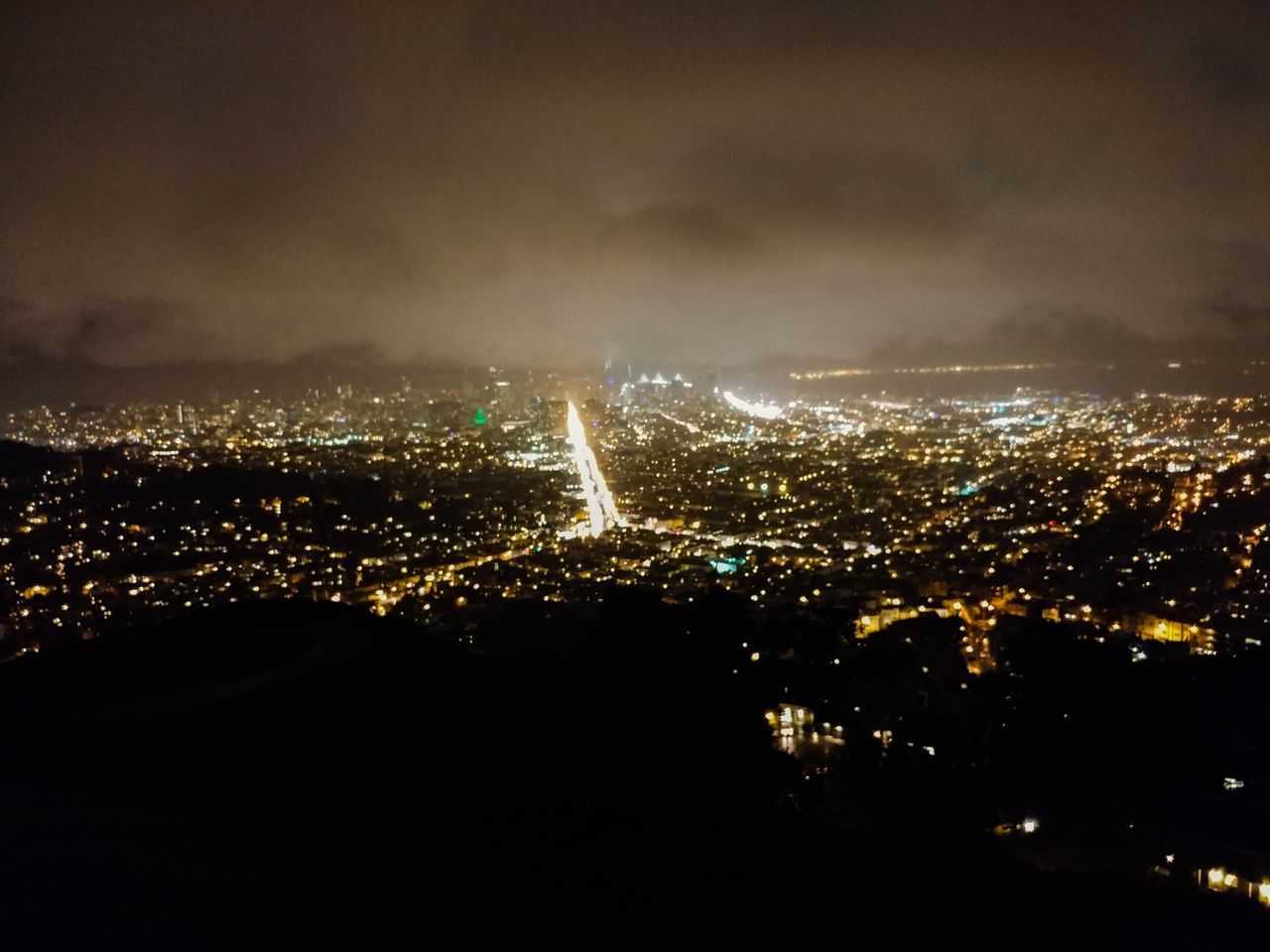 ILLUMINATED CITYSCAPE AT NIGHT