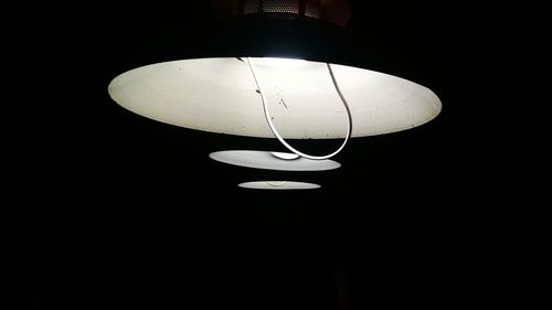 Low angle view of illuminated pendant light