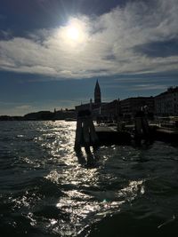 Scenic view of sea against cloudy sky