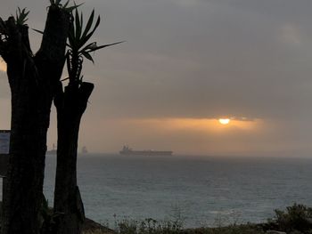 Scenic view of sea against sky during sunset