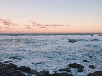 Scenic view of sea against sky during sunset