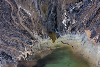 High angle view of water flowing through rocks