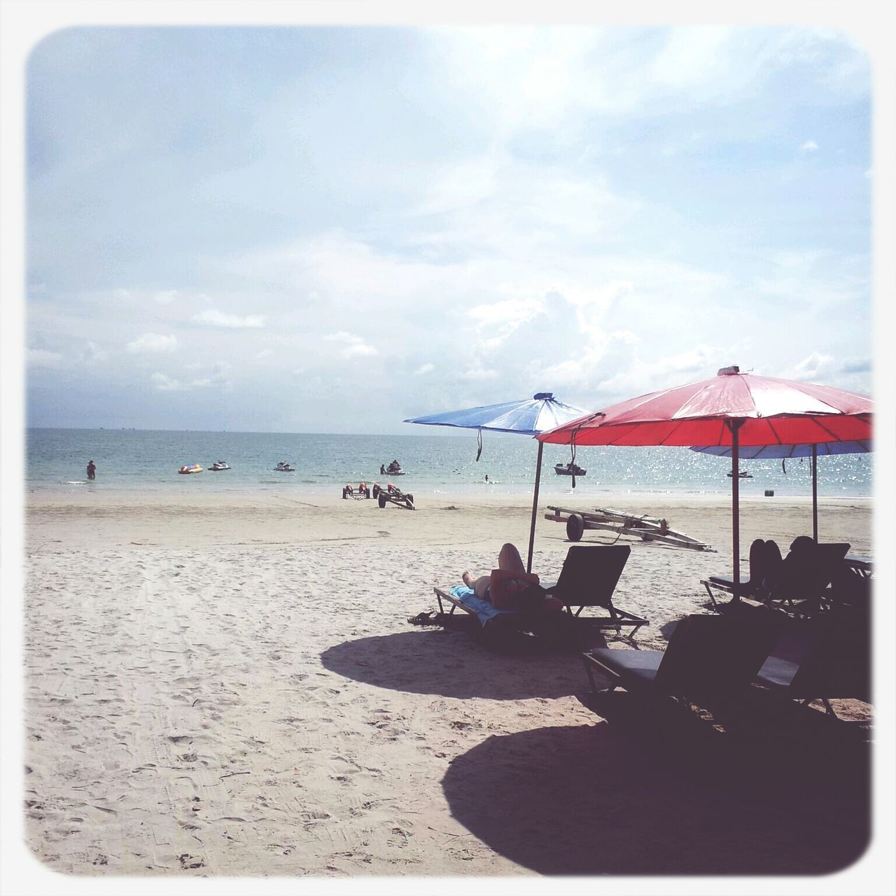 beach, sea, sand, horizon over water, transfer print, sky, shore, auto post production filter, water, cloud - sky, vacations, sunlight, beach umbrella, cloud, tranquility, scenics, incidental people, tranquil scene, nature, outdoors