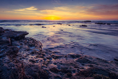 Scenic view of sea against sky during sunset