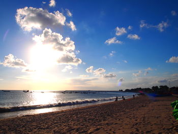 Scenic view of beach against blue sky