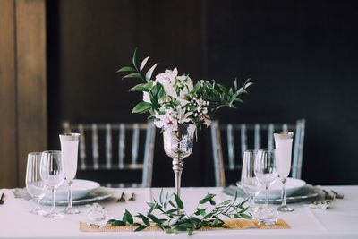 Flower vase on table at restaurant