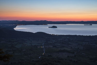 Scenic view of lake during sunset