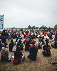 Group of people at street market against sky