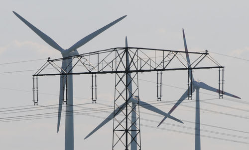 Low angle view of wind turbine against sky