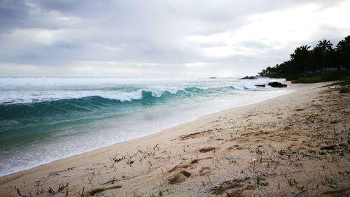 Scenic view of beach against sky