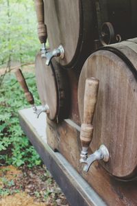 Close-up of old wooden wheel on field