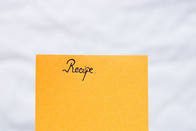 Close-up of yellow text on paper