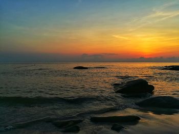 Scenic view of sea against sky during sunset