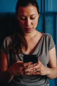 Midsection of woman using mobile phone