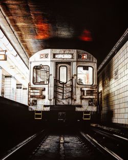 Train at railroad station at night