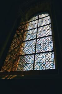 Low angle view of glass window in historic building