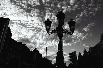 Low angle view of street light against sky