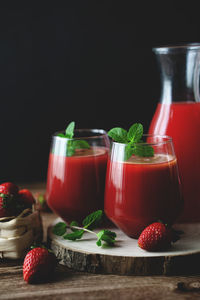 Red wine in glass jar on table