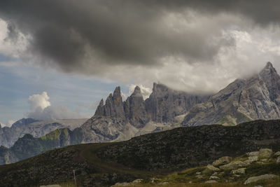 Scenic view of mountains against cloudy sky