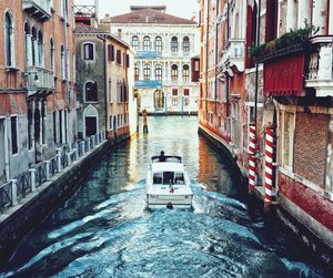 Canal amidst buildings in city