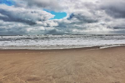 Scenic view of beach against sky