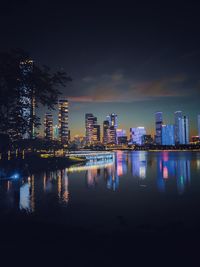 Illuminated buildings in city at night