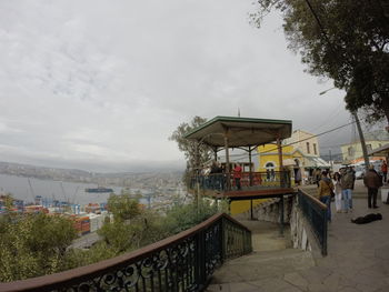 People at observation point against sky