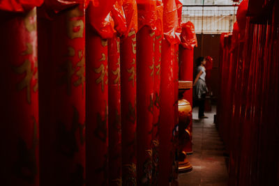 Interior of temple with woman in background