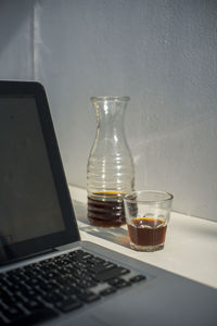 Close-up of wine glasses on table
