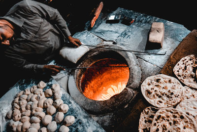 High angle view of man preparing food